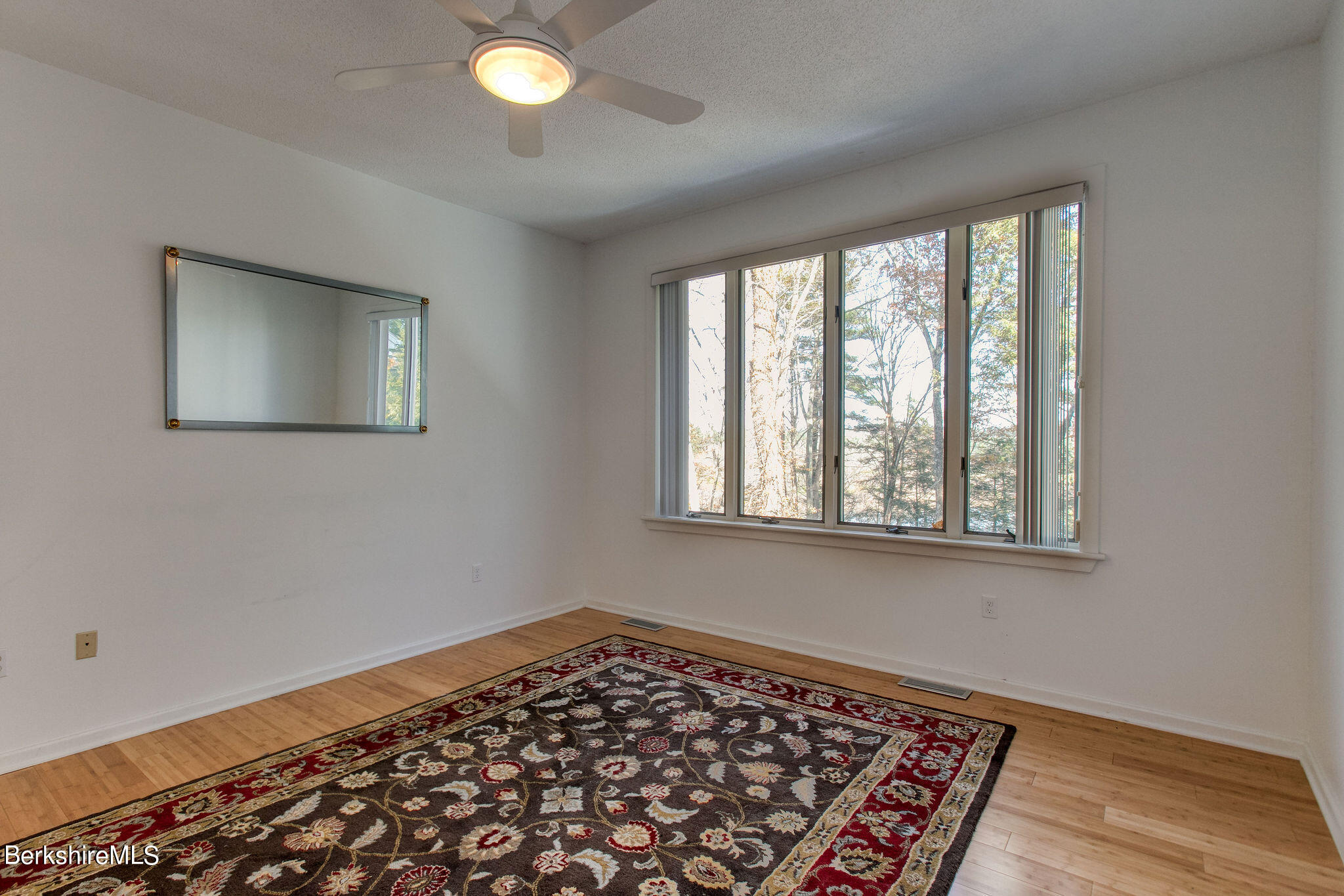 770 Summer Street, Unit 13B Lee, MA 01240 - Photo 12 of 39 a view of a room with wooden floor and windows
