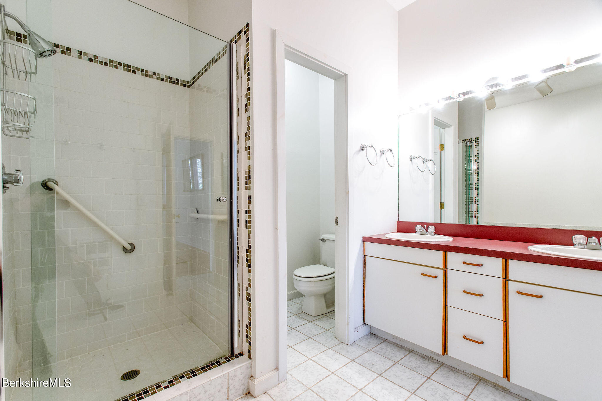 770 Summer Street, Unit 13B Lee, MA 01240 - Photo 13 of 39 a bathroom with a shower a sink and a mirror