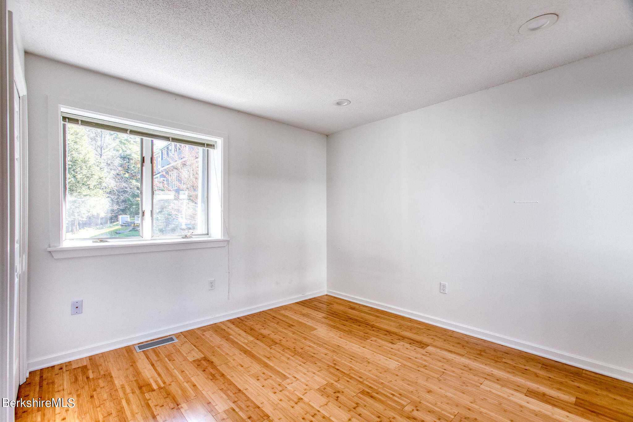 770 Summer Street, Unit 13B Lee, MA 01240 - Photo 17 of 39 a view of empty room with wooden floor