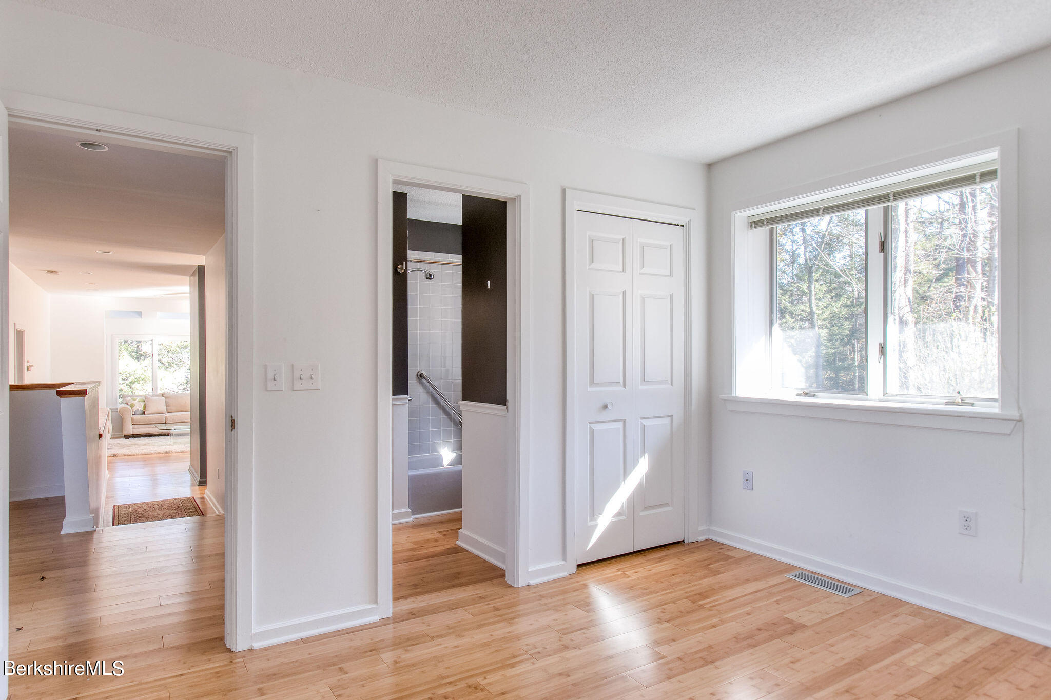 770 Summer Street, Unit 13B Lee, MA 01240 - Photo 18 of 39 wooden floor in an empty room with a window