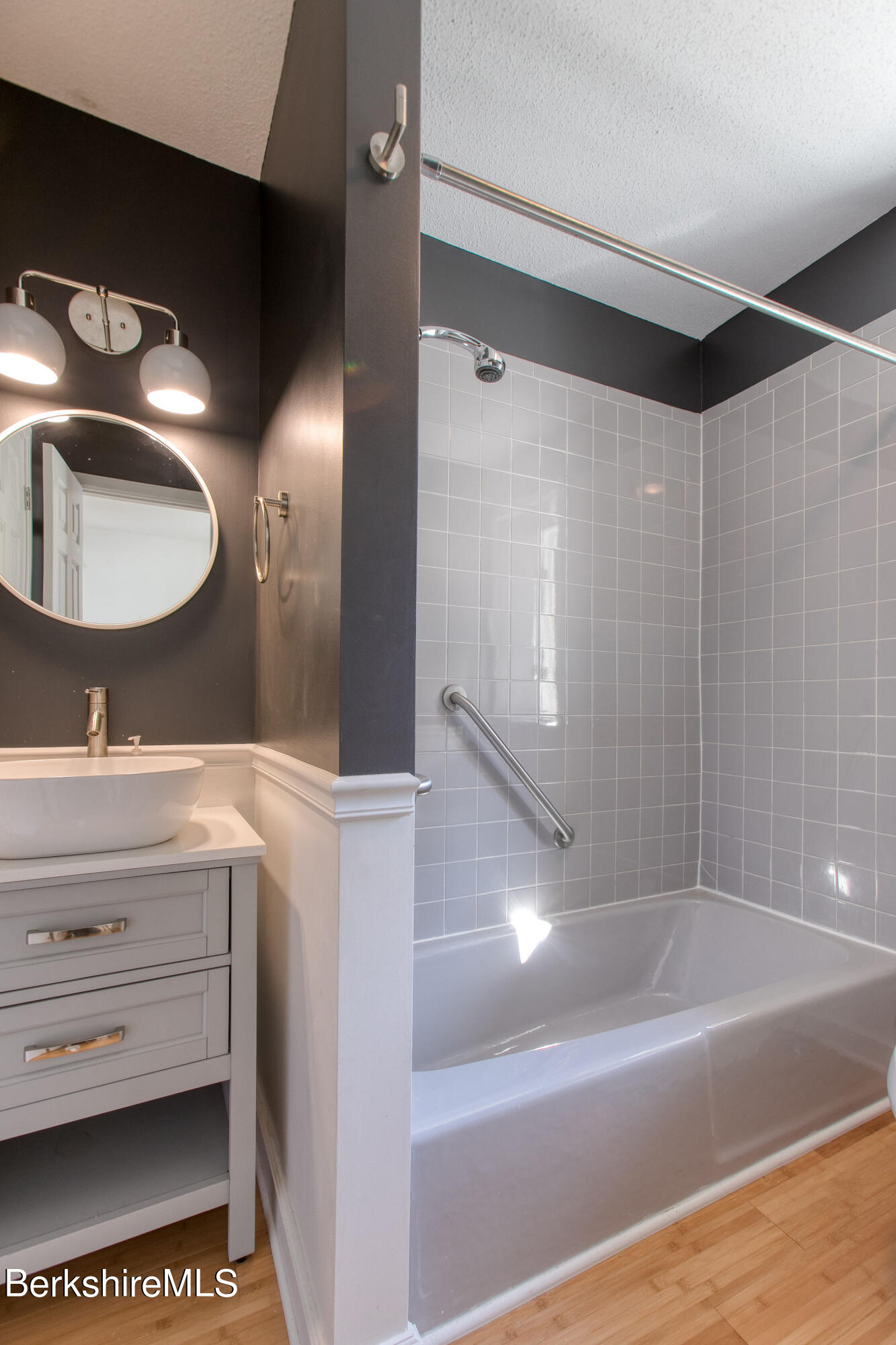 770 Summer Street, Unit 13B Lee, MA 01240 - Photo 20 of 39 a bathroom with a sink and a mirror