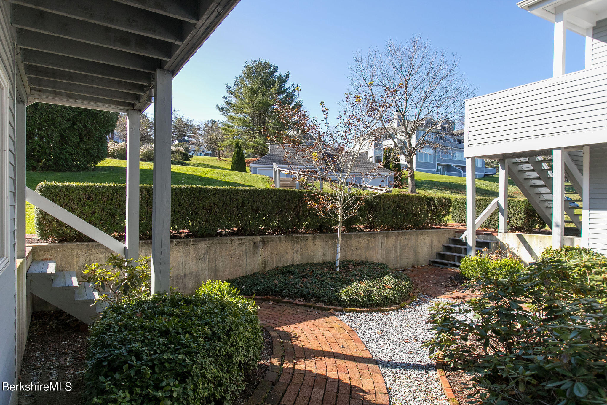 770 Summer Street, Unit 13B Lee, MA 01240 - Photo 36 of 39 a view of a backyard with potted plants