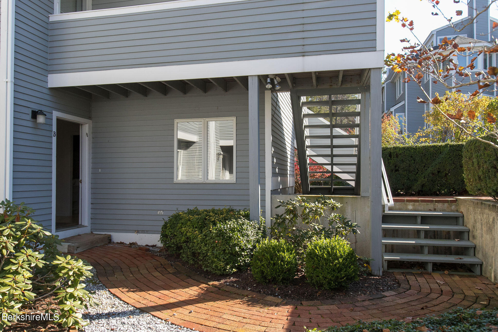 770 Summer Street, Unit 13B Lee, MA 01240 - Photo 37 of 39 a front view of a house with a garden