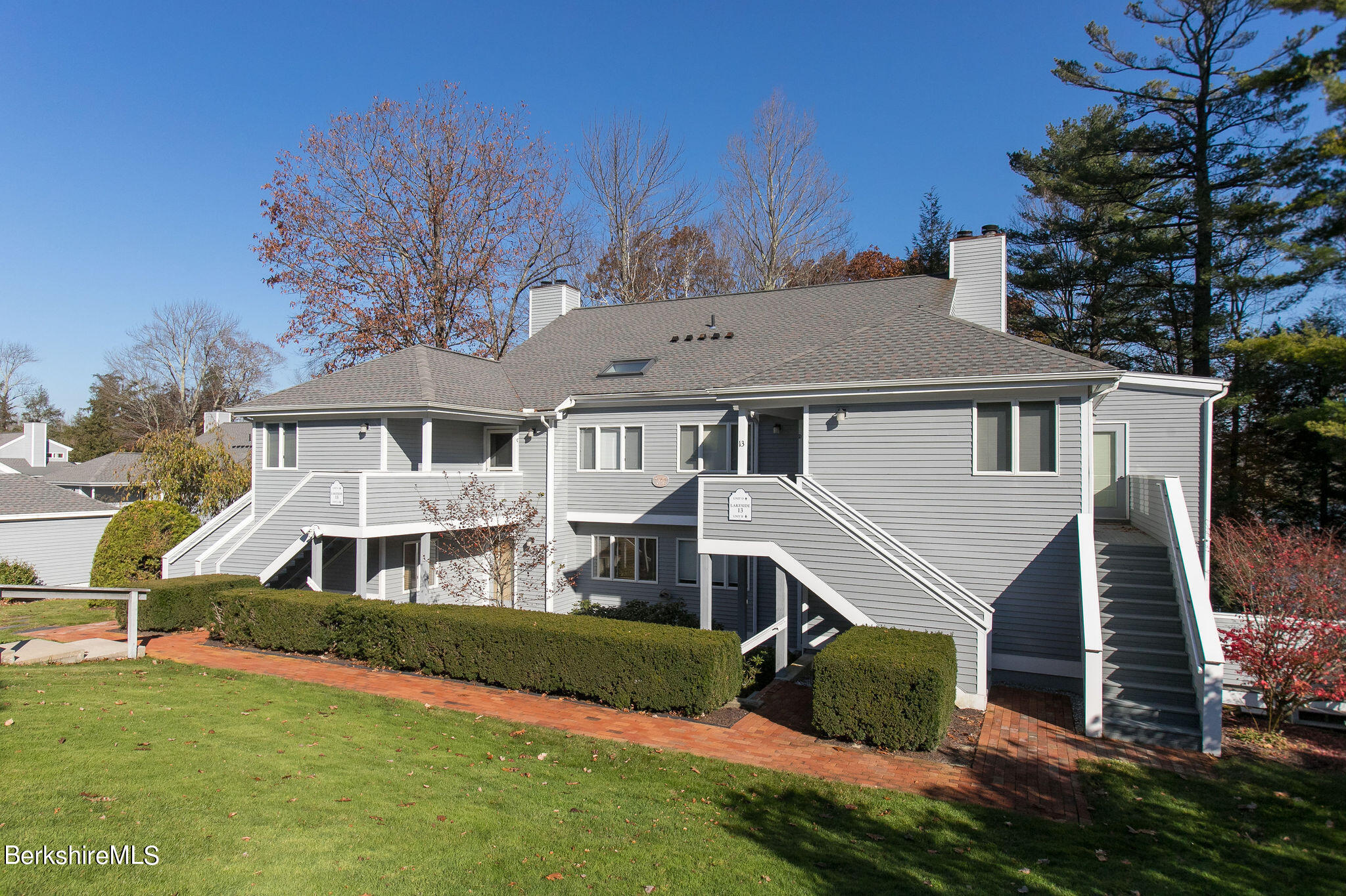 770 Summer Street, Unit 13B Lee, MA 01240 - Photo 39 of 39 a aerial view of a house next to a yard