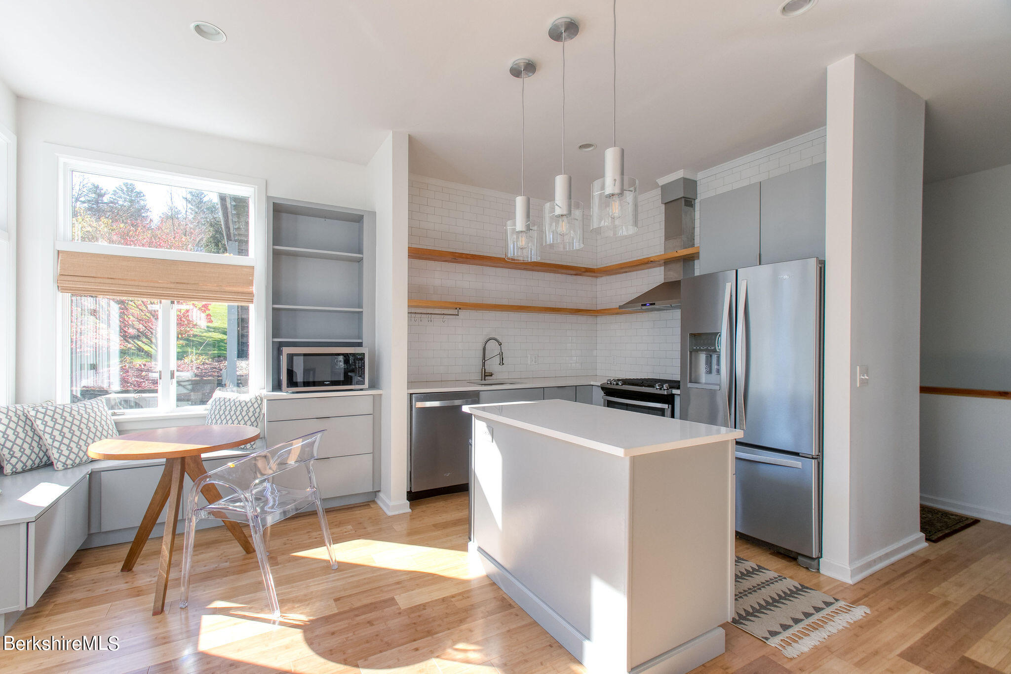 770 Summer Street, Unit 13B Lee, MA 01240 - Photo 5 of 39 a kitchen with kitchen island a stove a refrigerator and a view of living room