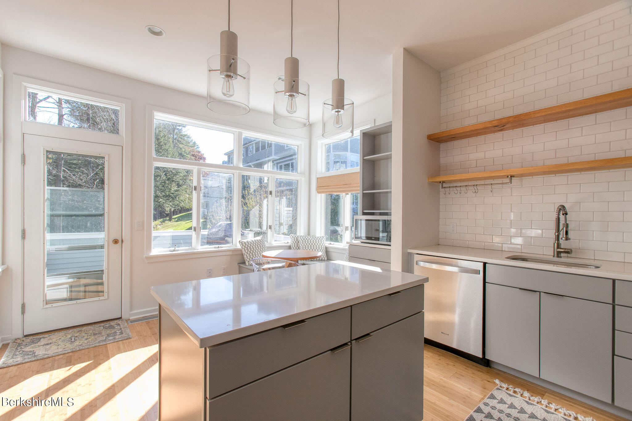 770 Summer Street, Unit 13B Lee, MA 01240 - Photo 7 of 39 a dining hall with stainless steel appliances granite countertop a sink and dishwasher with wooden floor