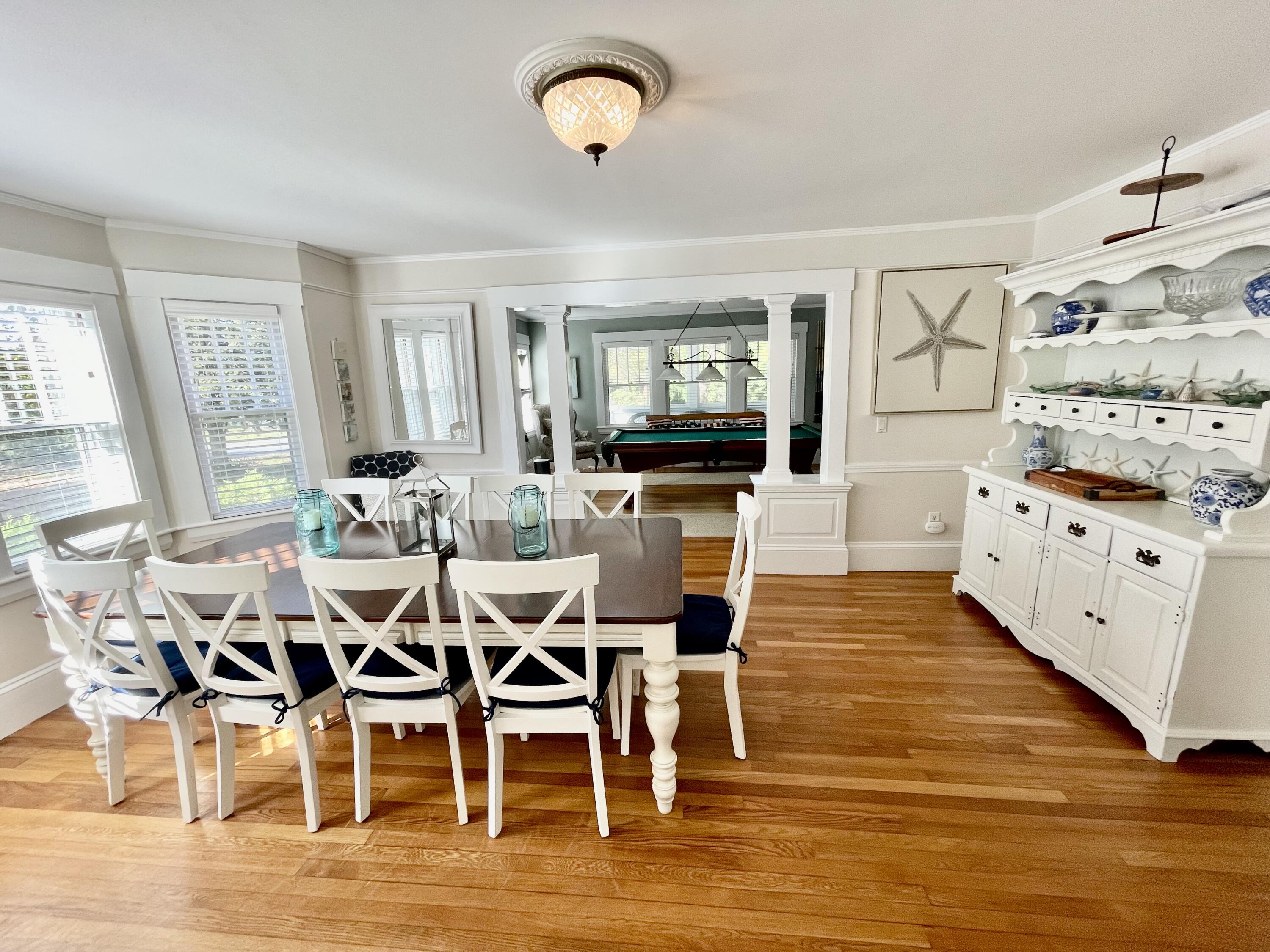 51 Beach Road Orleans, MA 02653 - Photo 15 of 46 a view of a dining room with furniture and wooden floor