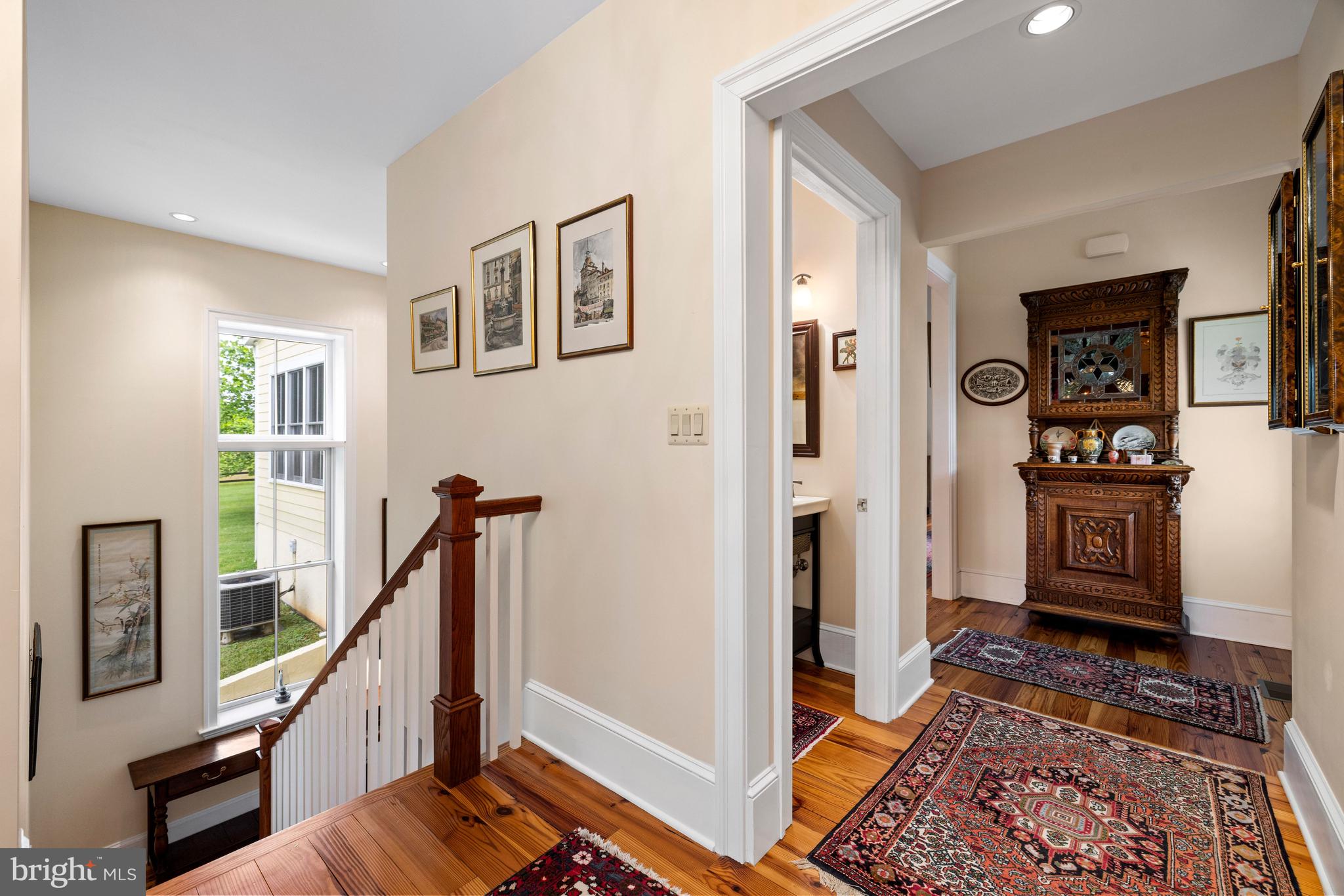 20147 Woodtrail Road Round Hill, VA 20141 - Photo 29 of 41 a view of a hallway with workspace and wooden floor