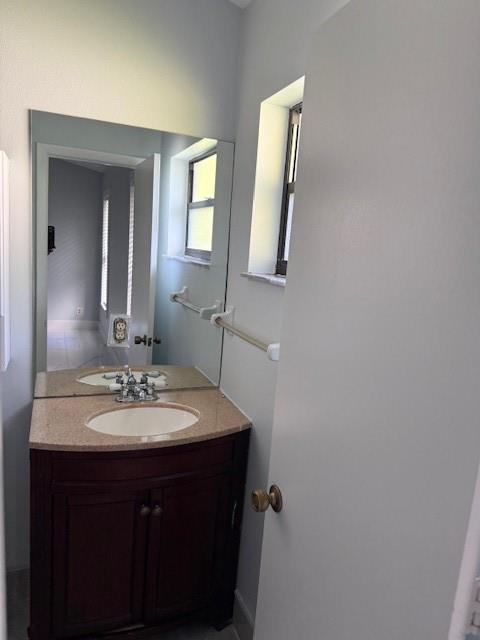 2355 Northwest 123rd Avenue Coral Springs, FL 33065 - Photo 10 of 10 a bathroom with a sink and a mirror