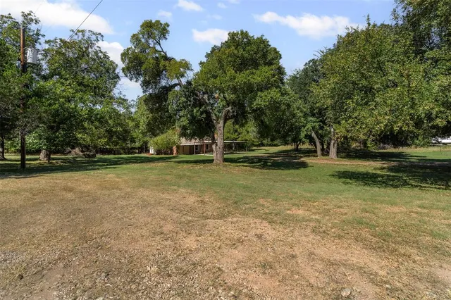 a view of outdoor space with deck and yard