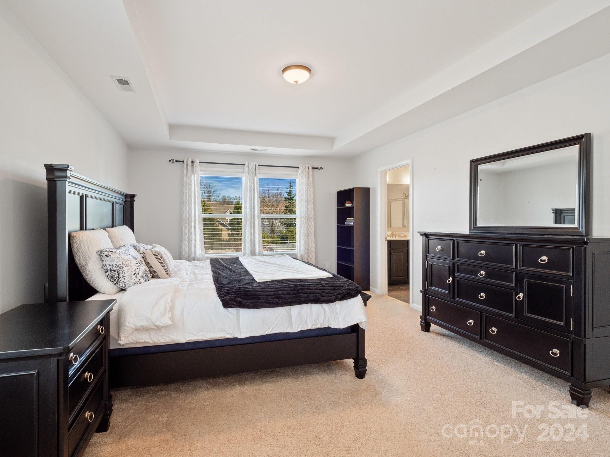 79469 Ridgehaven Road Lancaster, SC 29720 - Photo 21 of 35 a bedroom with a bed and a dresser