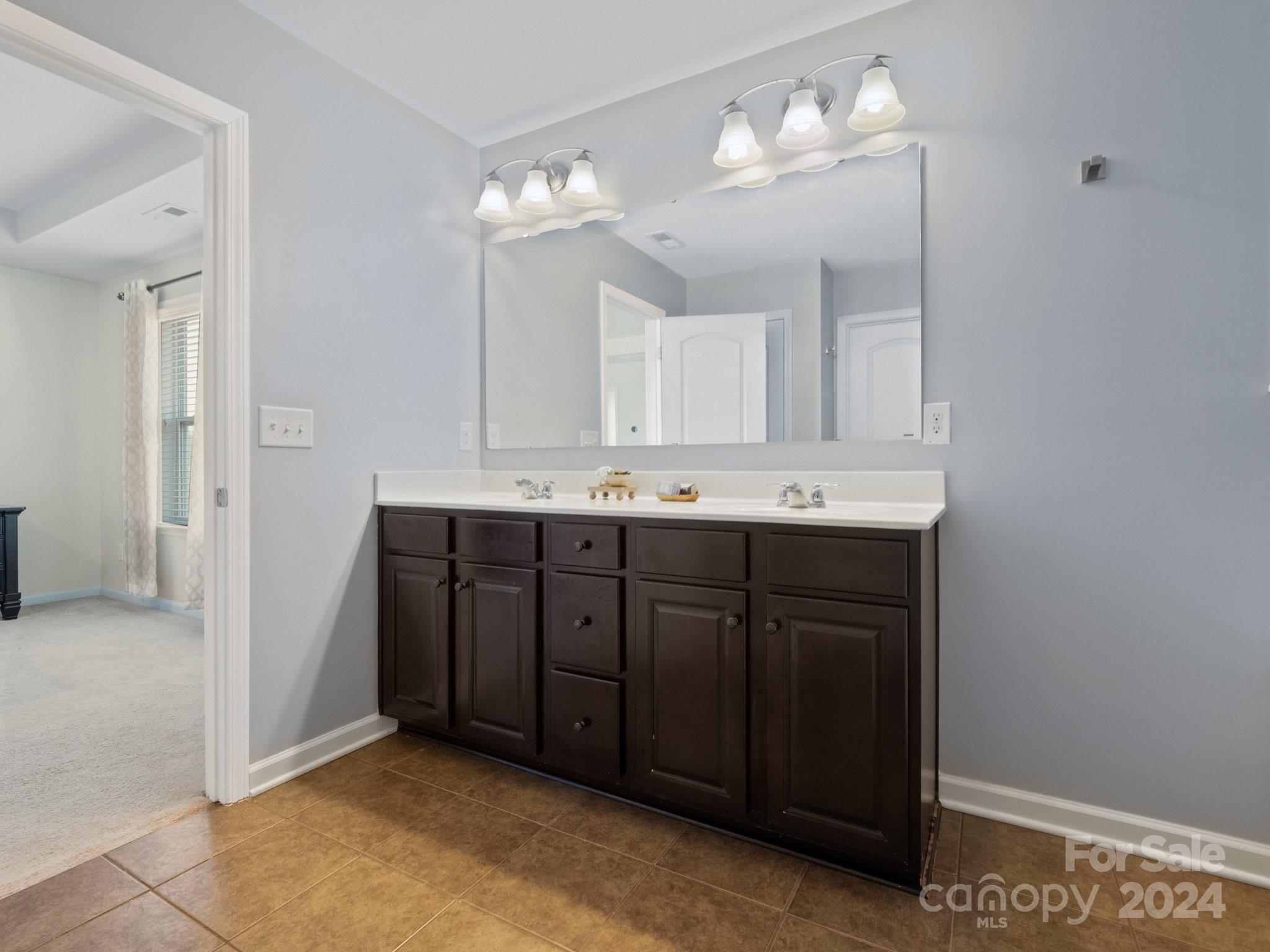 79469 Ridgehaven Road Lancaster, SC 29720 - Photo 24 of 35 a bathroom with a sink vanity and a mirror