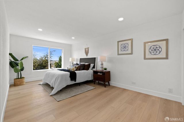 a bed room with a bed and a couch