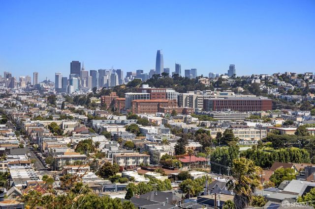 a view of a city with tall buildings