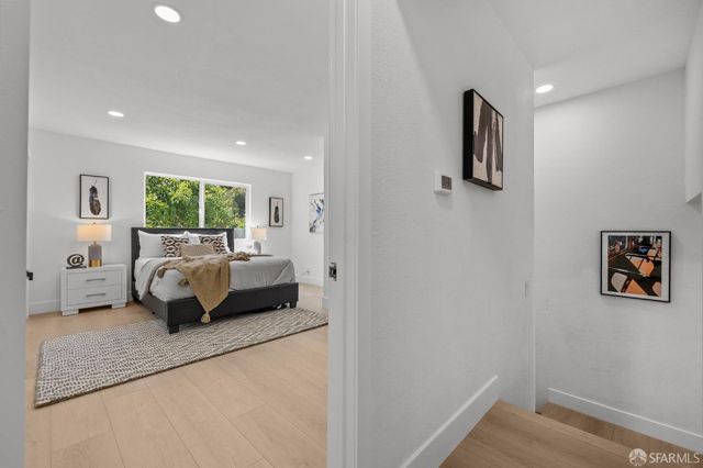 a bedroom with a bed and a couch