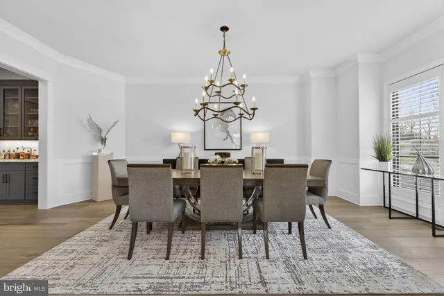a living room with furniture a fireplace and a large window