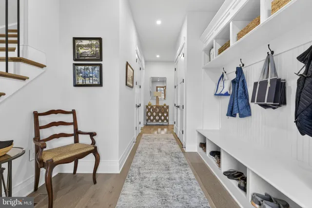 a view of an empty room and wooden floor
