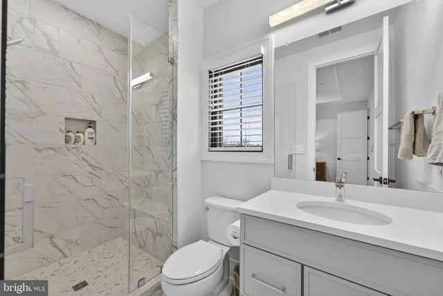 a view of a balcony with couch and wooden floor