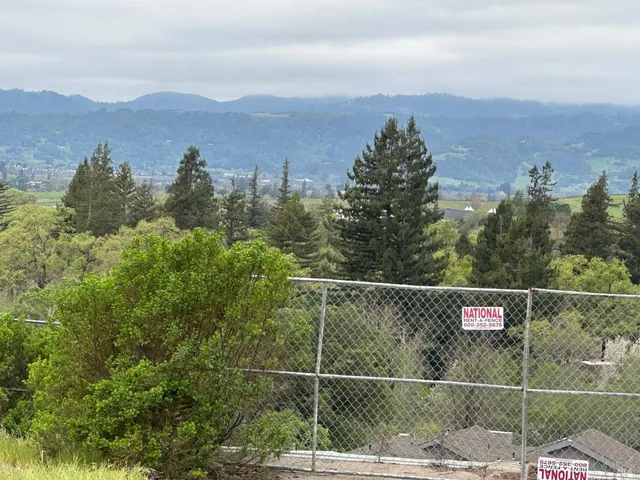 a view of city and mountain view from a balcony