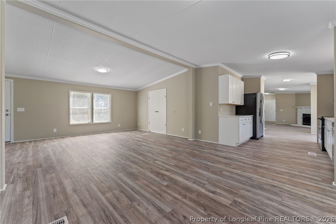 515 Mt Zion Road Red Springs, NC 28377 - Photo 11 of 50 a view of empty room with wooden floor
