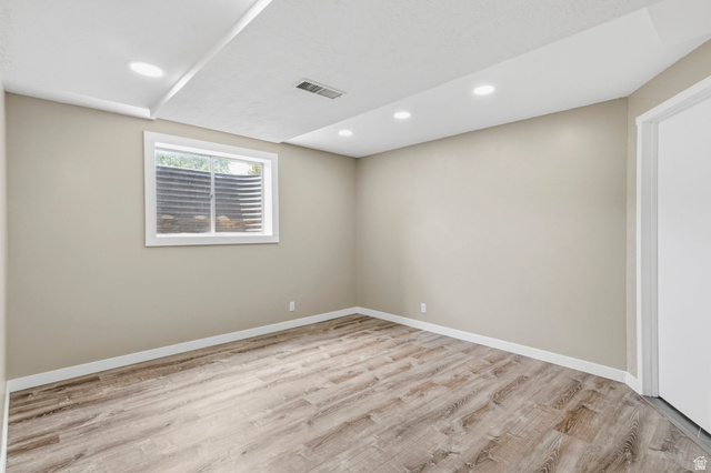 2693 Teal Way Sandy, UT 84093 - Photo 36 of 50 Neutral tone walls and wood-finish flooring define this room
