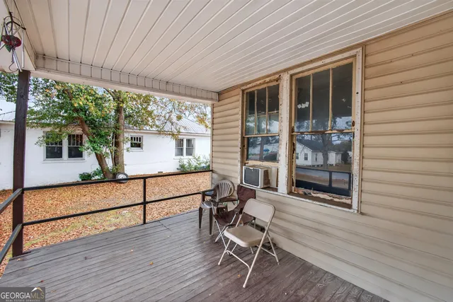 a view of a chairs and table in a patio