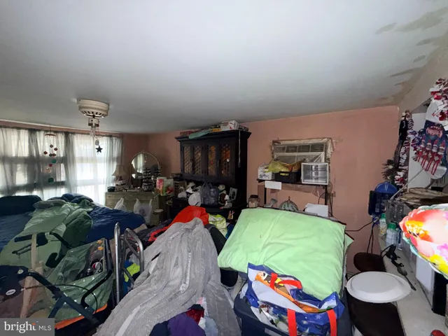 a living room filled with furniture and a chandelier