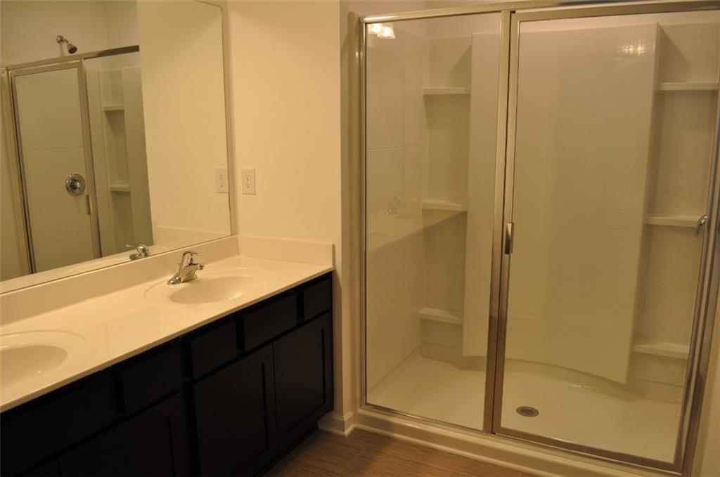 5745 Thornton Drive Cumming, GA 30028 - Photo 17 of 45 a bathroom with a shower and a sink
