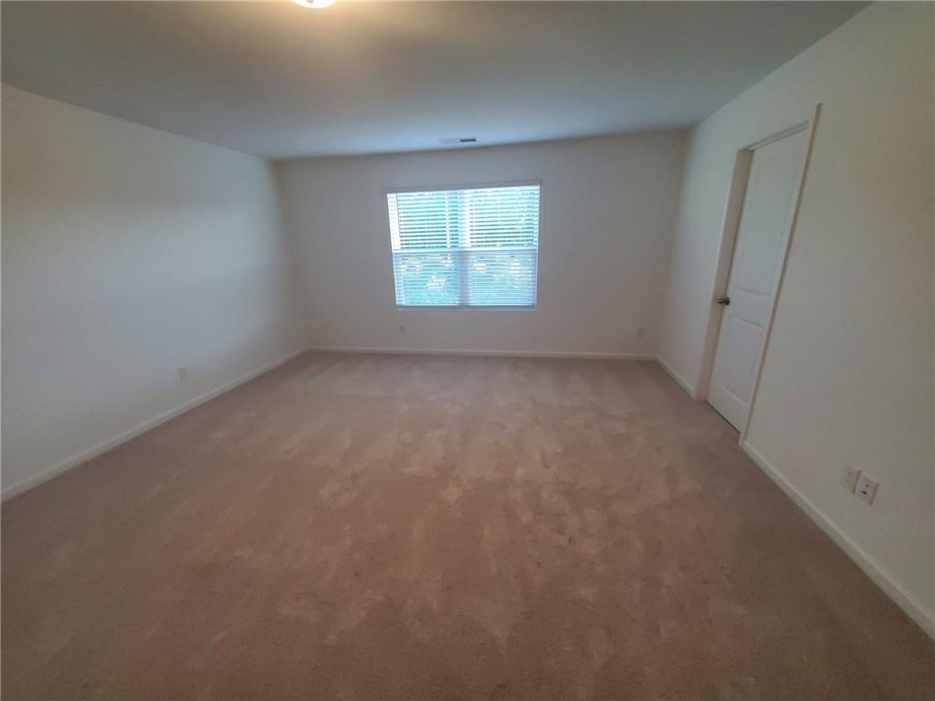 5745 Thornton Drive Cumming, GA 30028 - Photo 18 of 45 an empty room with a window