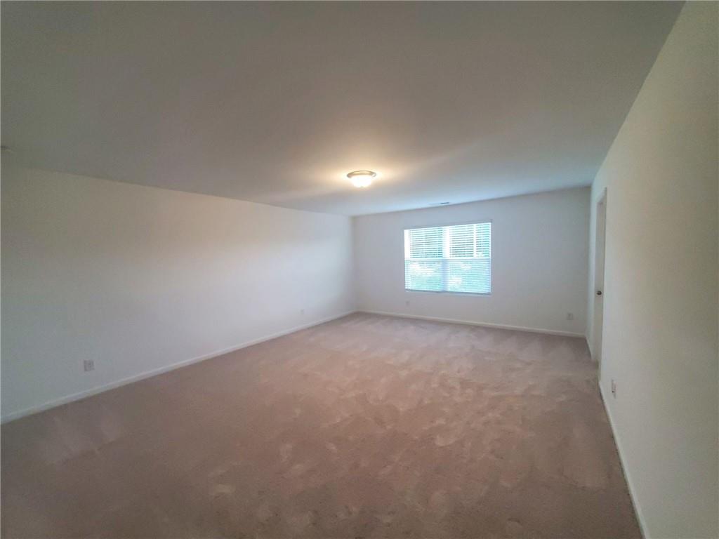 5745 Thornton Drive Cumming, GA 30028 - Photo 19 of 45 a view of an empty room and a window