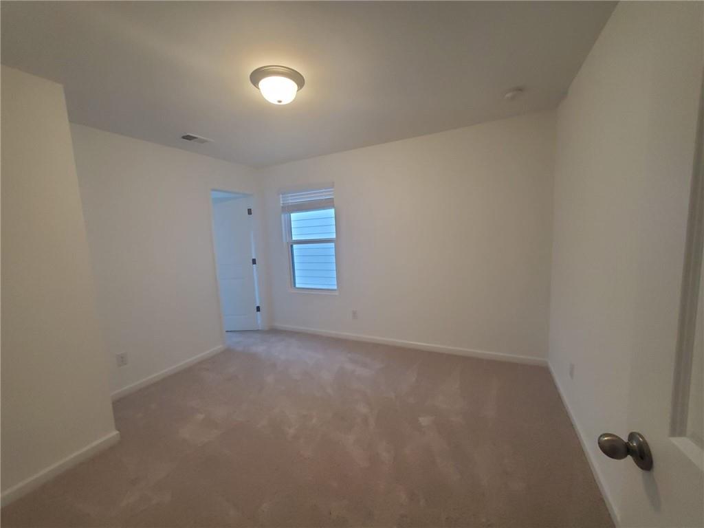5745 Thornton Drive Cumming, GA 30028 - Photo 23 of 45 a view of an empty room