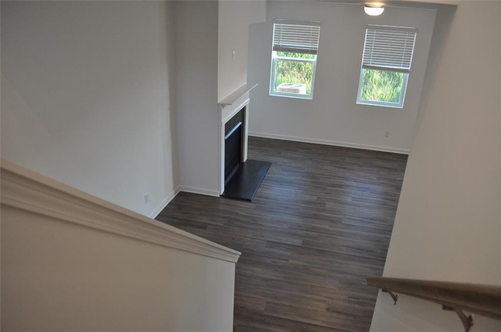5745 Thornton Drive Cumming, GA 30028 - Photo 25 of 45 an empty room with wooden floor and windows