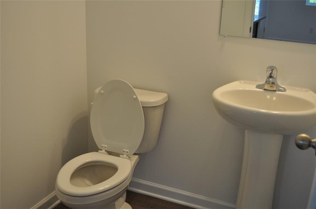 5745 Thornton Drive Cumming, GA 30028 - Photo 26 of 45 a bathroom with a toilet and a sink