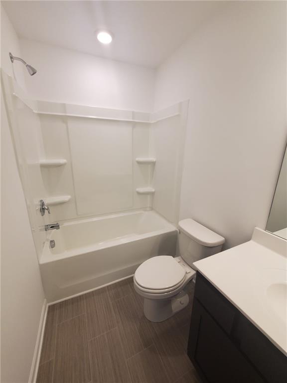 5745 Thornton Drive Cumming, GA 30028 - Photo 28 of 45 a bathroom with a toilet a sink and bathtub