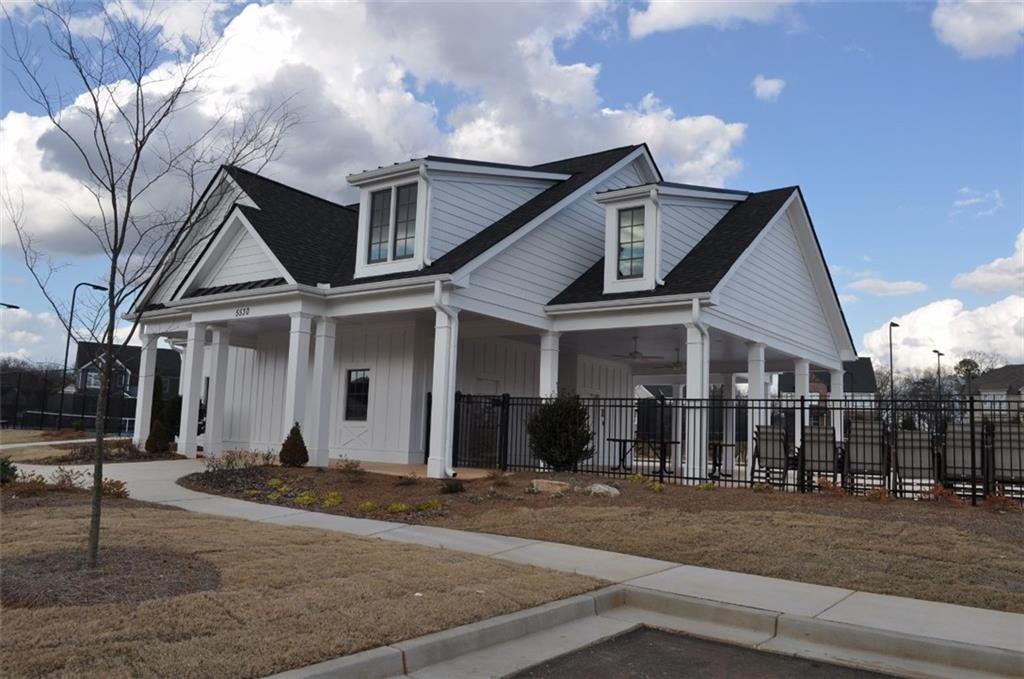 5745 Thornton Drive Cumming, GA 30028 - Photo 40 of 45 a front view of a house with a yard