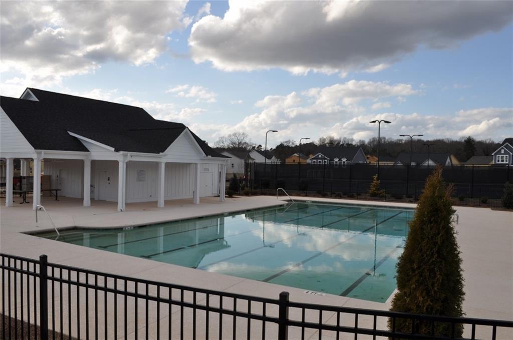 5745 Thornton Drive Cumming, GA 30028 - Photo 41 of 45 a view of a swimming pool with a yard from a balcony