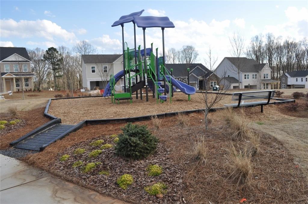 5745 Thornton Drive Cumming, GA 30028 - Photo 45 of 45 a view of a park with iron fence