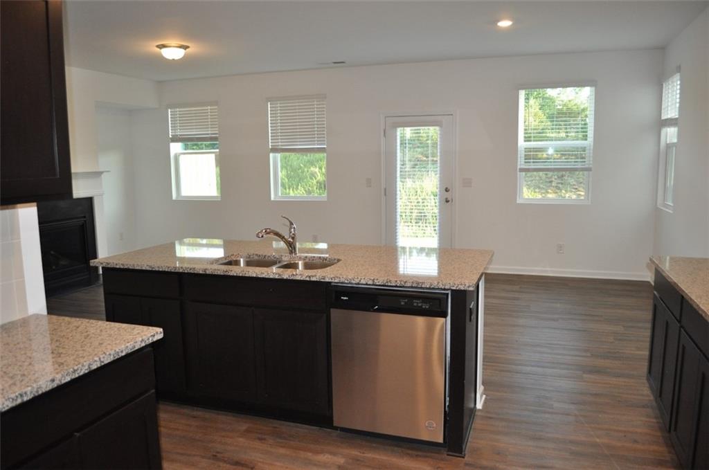 5745 Thornton Drive Cumming, GA 30028 - Photo 9 of 45 a kitchen with a sink cabinets and wooden floor