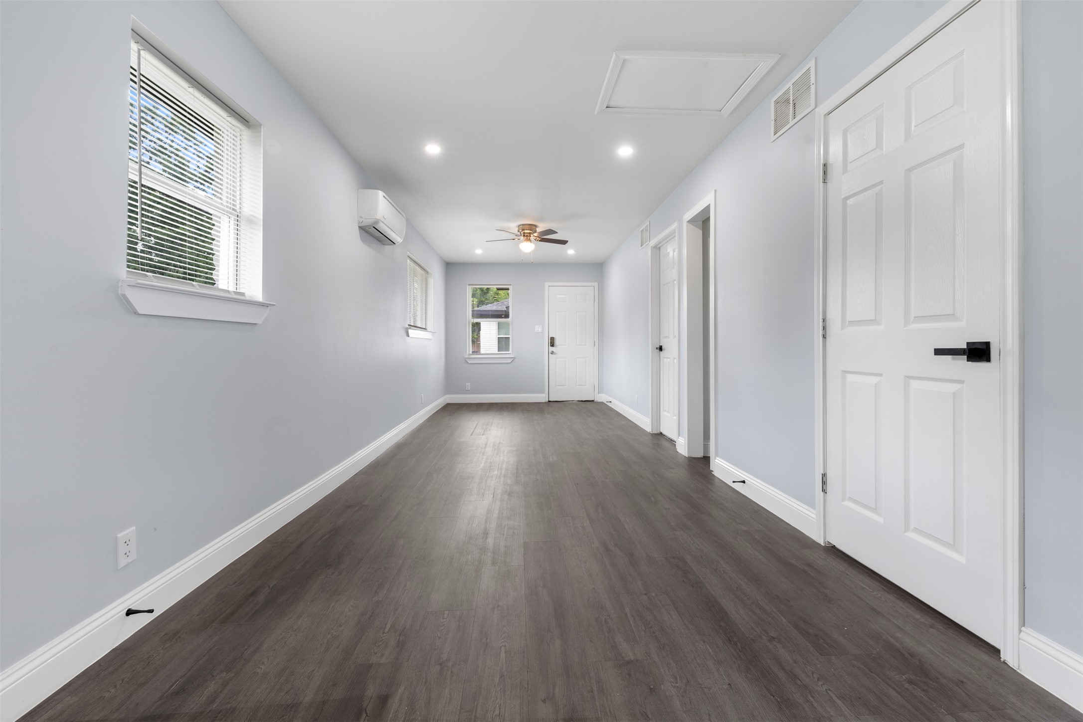 4116 Linn Street, Unit A Houston, TX 77026 - Photo 2 of 8 a view of an empty room with wooden floor and a window