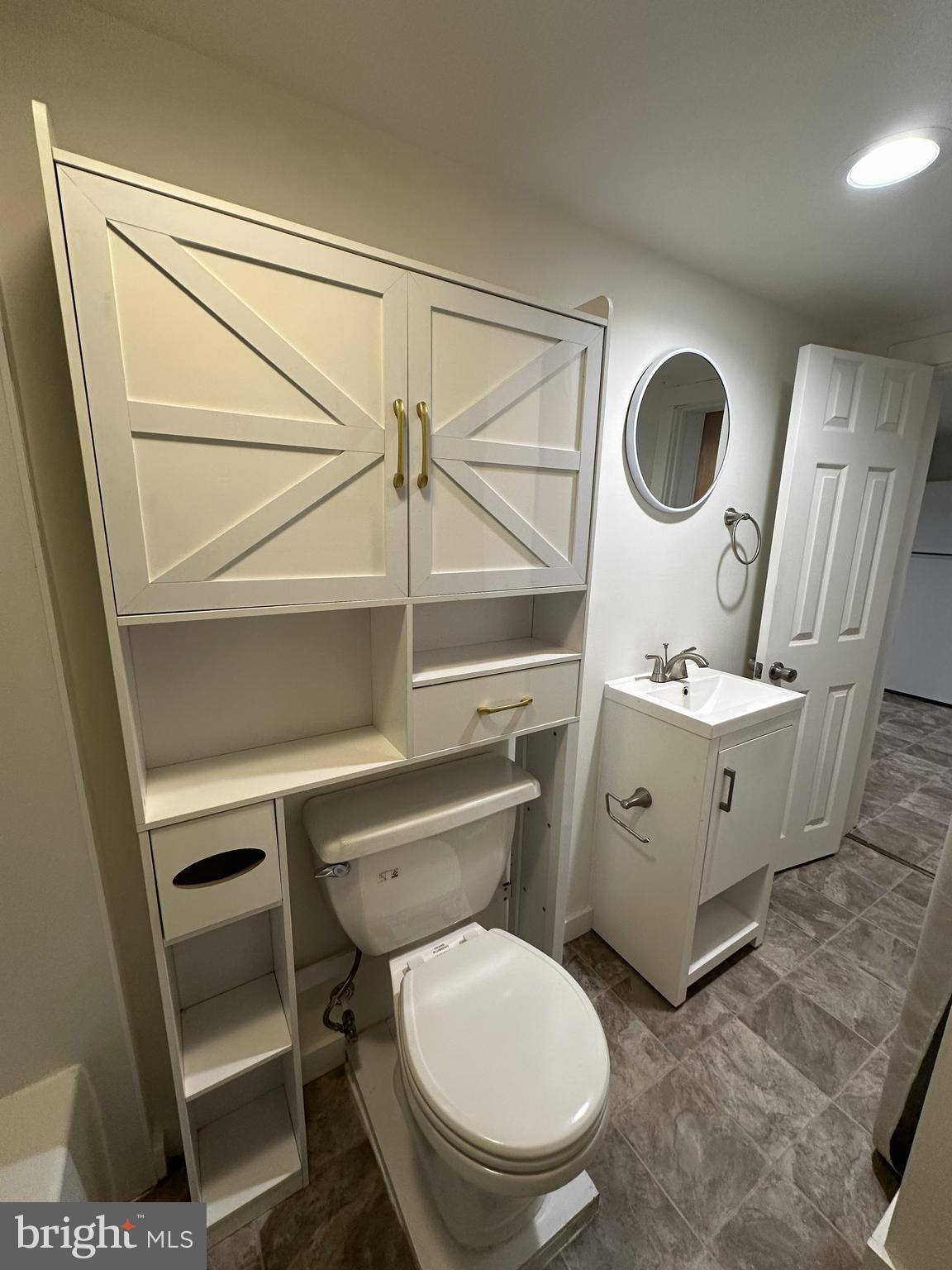 45 Warrenton Road, Unit 2 Fredericksburg, VA 22405 - Photo 5 of 8 a bathroom with a toilet a sink and a mirror