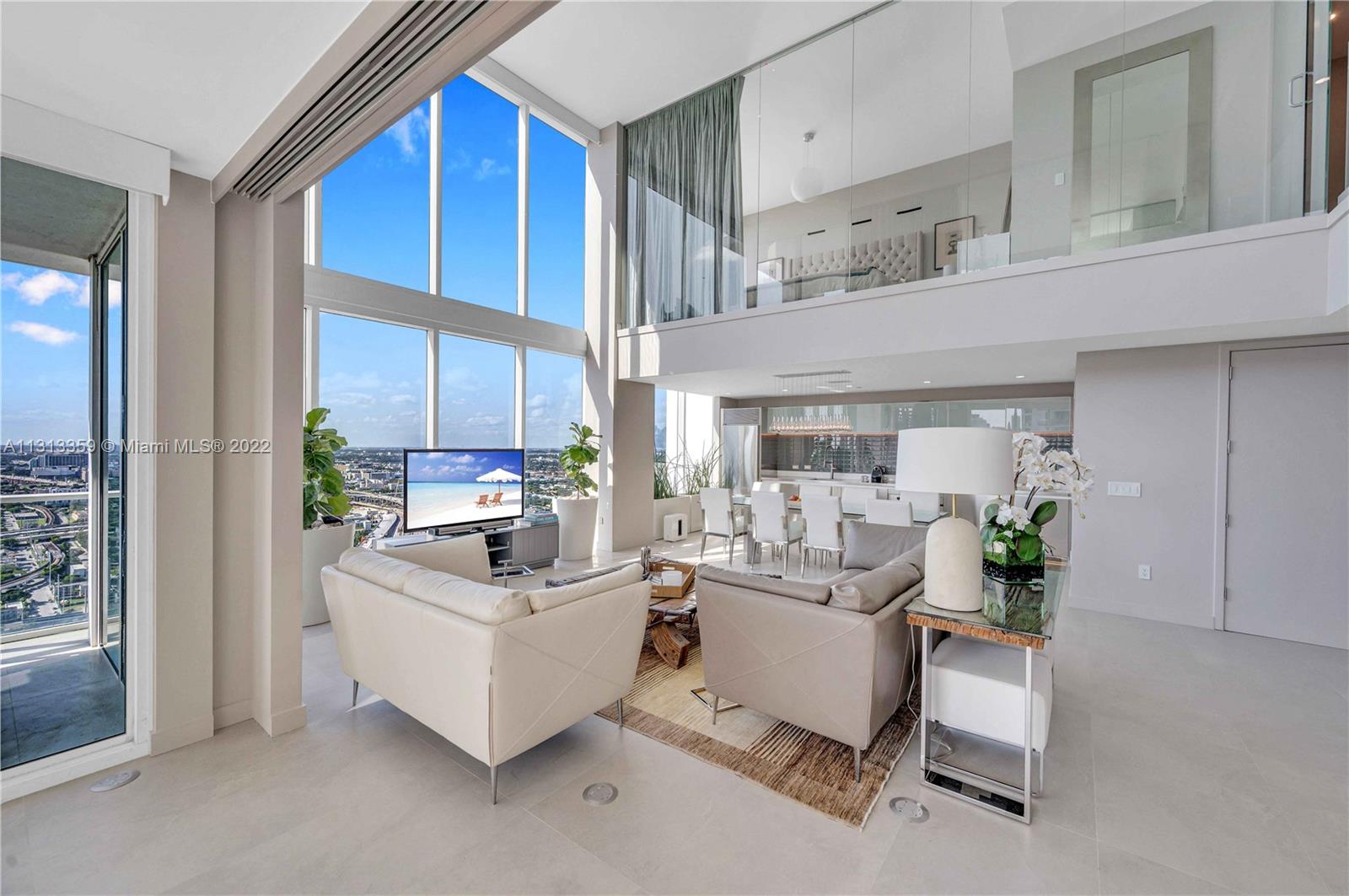 1040 Biscayne Boulevard, Unit PH4407 Miami, FL 33132 - Photo 15 of 74 a living room with furniture and a large window