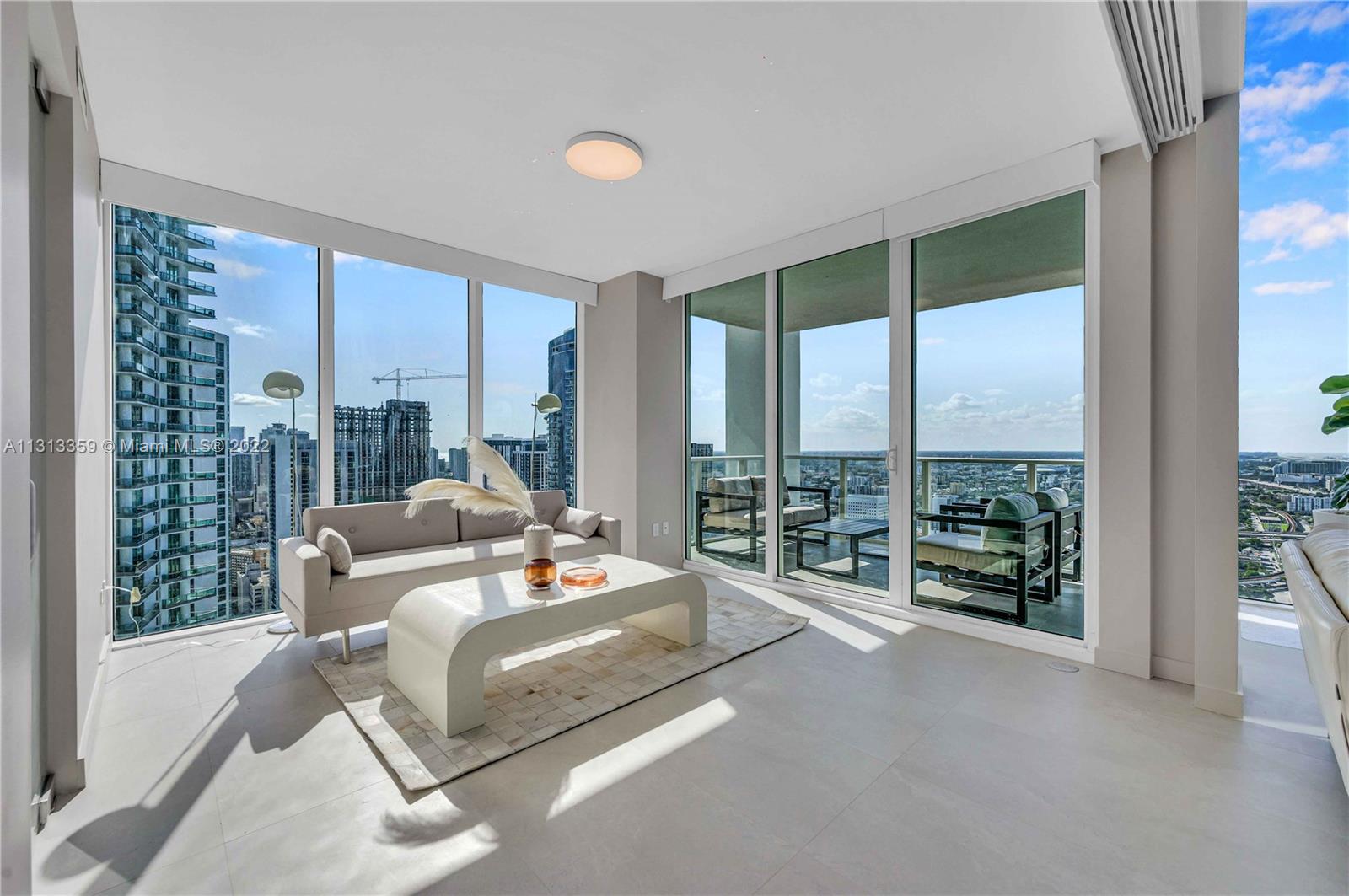 1040 Biscayne Boulevard, Unit PH4407 Miami, FL 33132 - Photo 19 of 74 a living room with furniture and a large window