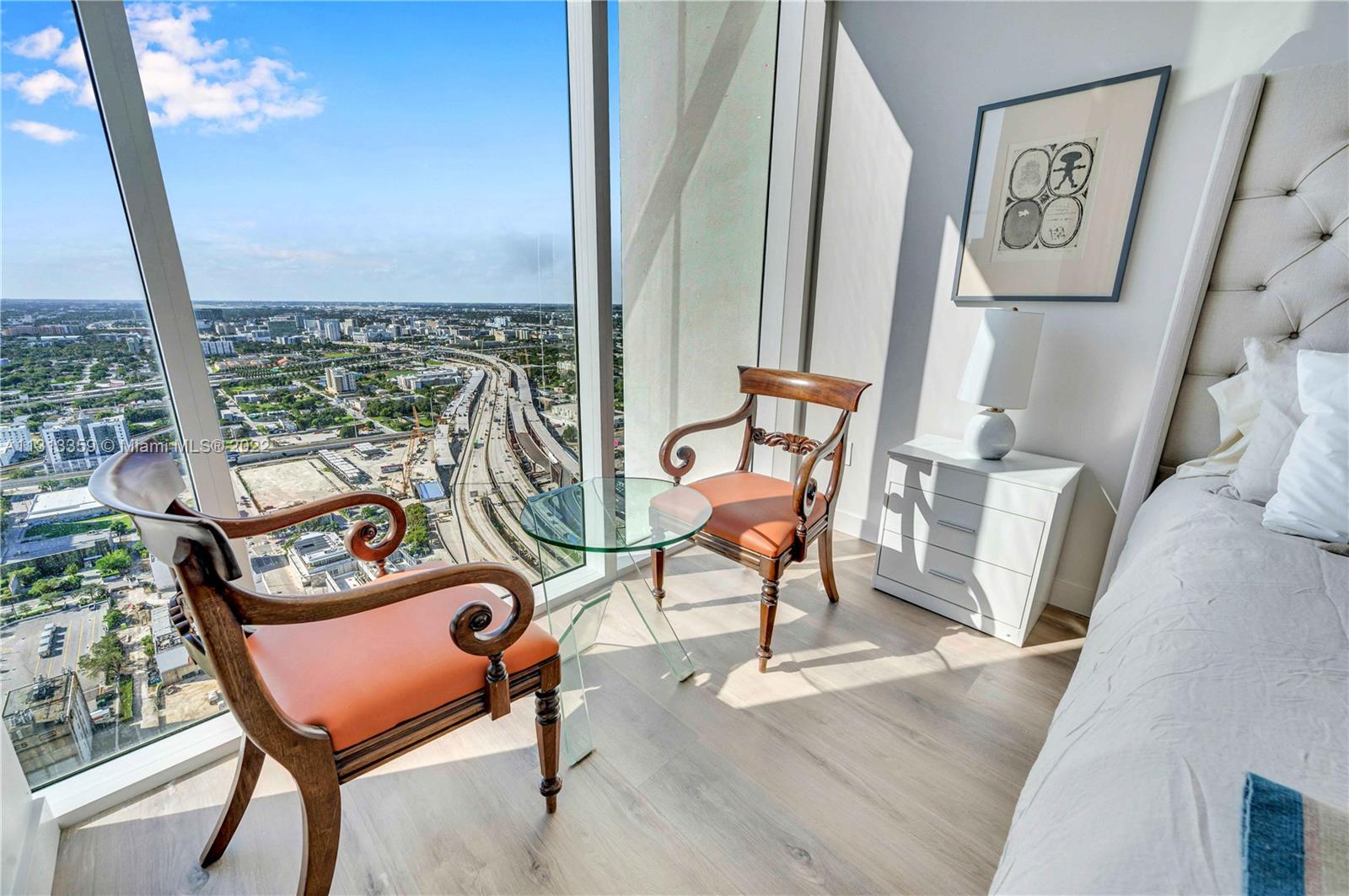 1040 Biscayne Boulevard, Unit PH4407 Miami, FL 33132 - Photo 41 of 74 a view of a chairs and table in a balcony