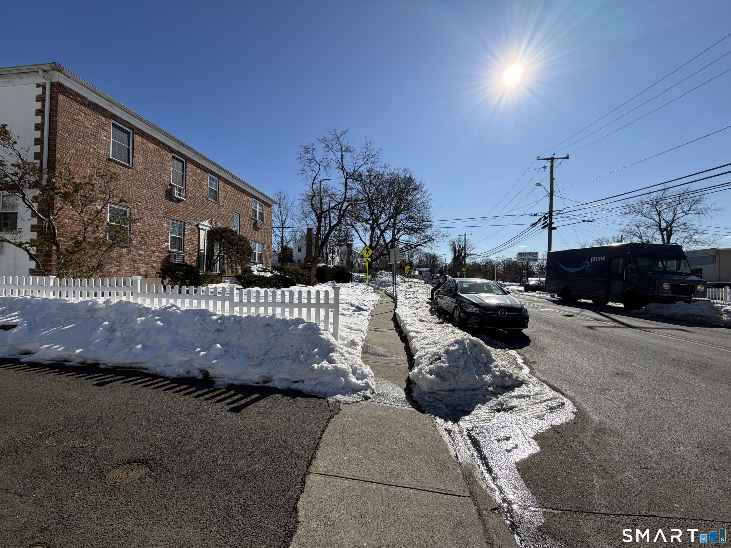 11 Belltown Road, Unit 1 Stamford, CT 06905 - Photo 3 of 10 a view of a street with cars parked