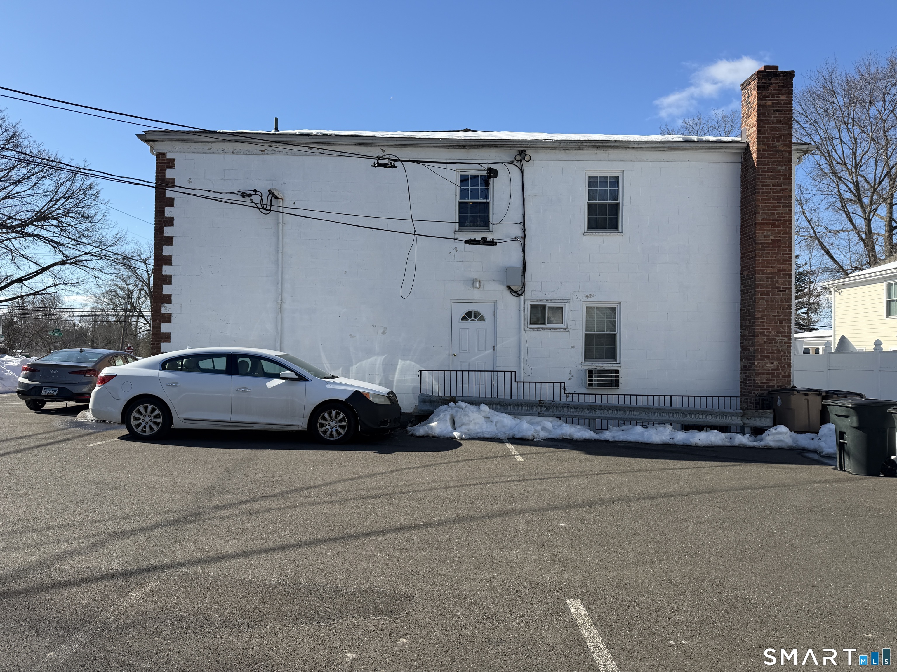 11 Belltown Road, Unit 1 Stamford, CT 06905 - Photo 7 of 10 a view of a car parked in front of a house