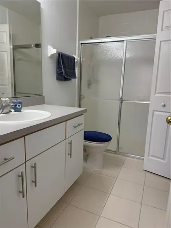 a bathroom with a sink toilet and mirror