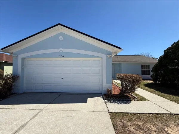 a front view of a house with sitting area