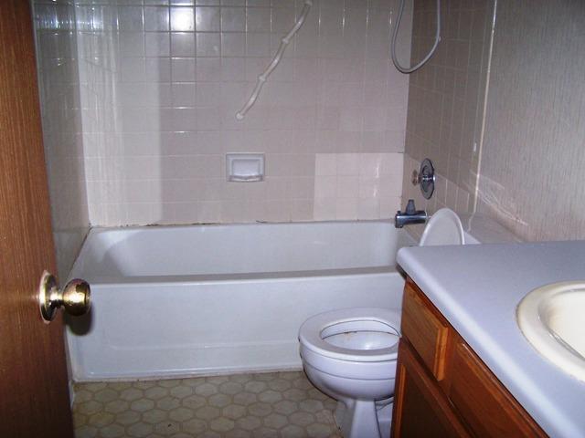 817 Lexington Road Elgin, TX 78621 - Photo 10 of 20 a bathroom with a sink a toilet and shower