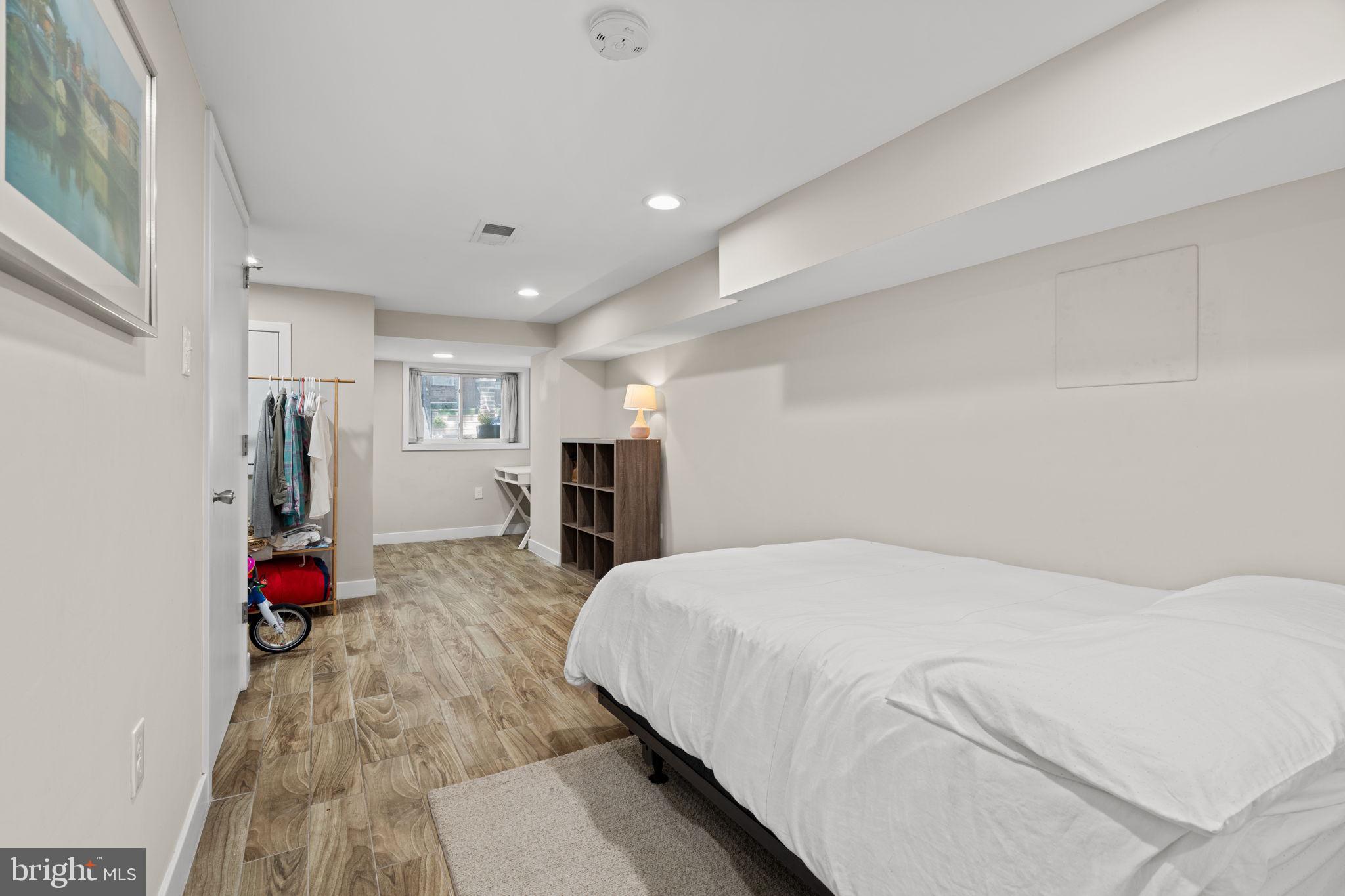 2934 Nicholas Street Philadelphia, PA 19121 - Photo 29 of 33 a bed room with a bed furniture and a flat tv screen