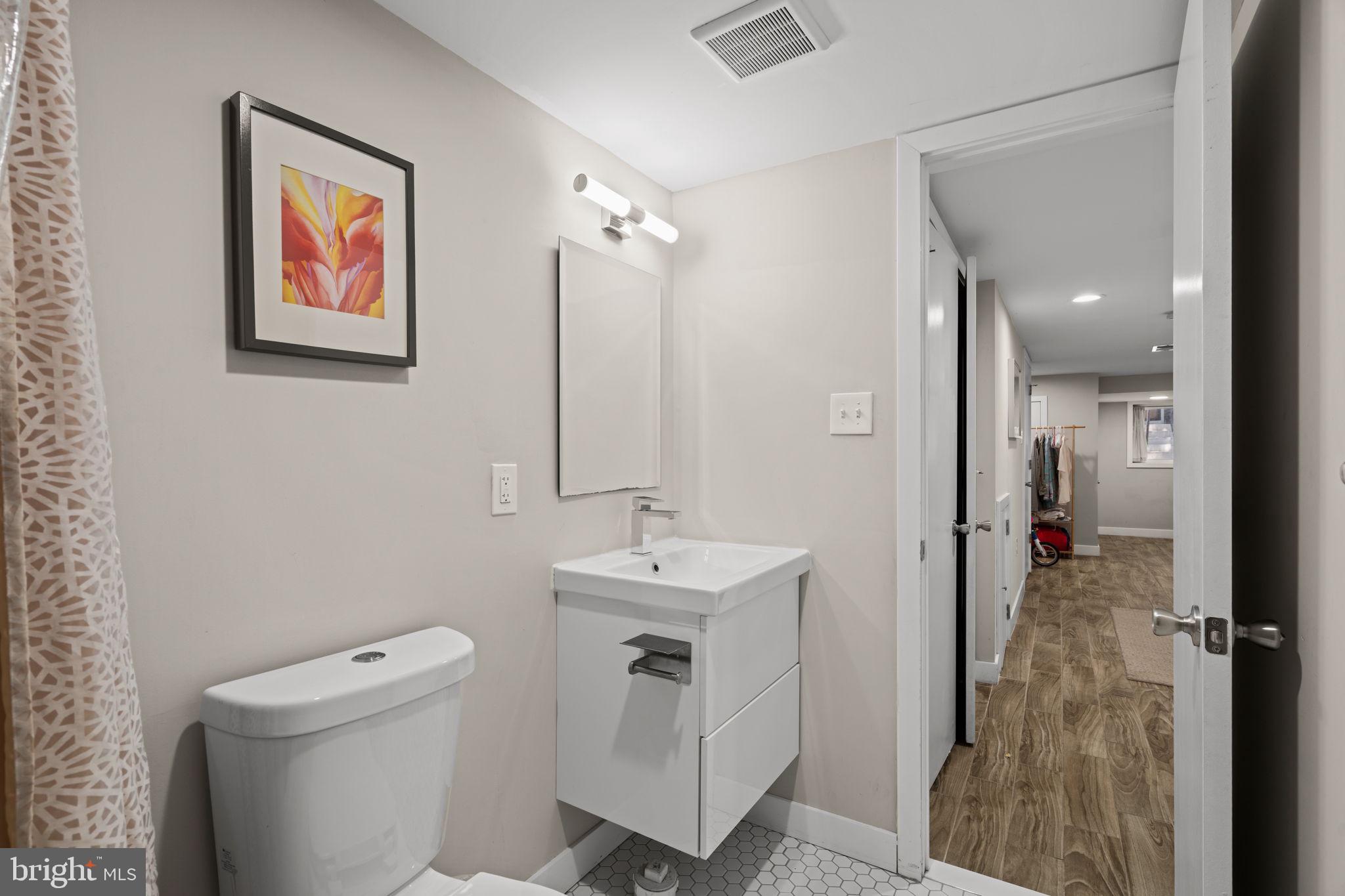 2934 Nicholas Street Philadelphia, PA 19121 - Photo 31 of 33 a bathroom with a sink toilet and shower